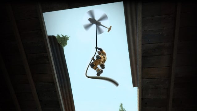 Un joueur descend dans un bâtiment via une corde d'hélicoptère dans Danger Zone de CS:GO.
