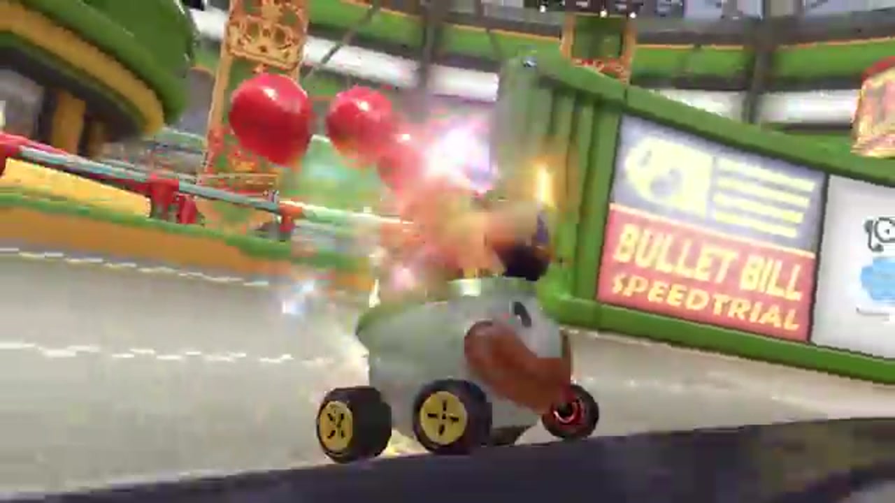 Capture in-game Mario Kart 8 Deluxe : course sur circuit Bullet Bill avec kart Shy Guy en pleine action et item Bombe visible à l'écran.